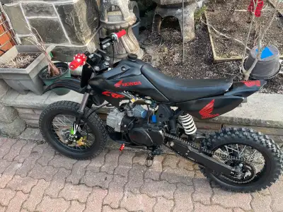 Starts first kick New back tire rim and sprocket Chain Handlebars Grips Footpegs New front brake Nee...