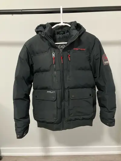 I'm selling a Super Triple Goose black puffer jacket, perfect for braving the Canadian winters with...