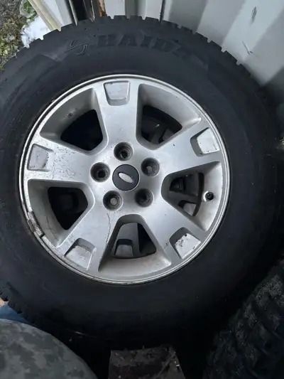 Originally from a 2001-2012 ford escape alloy rims and snow tires. 235/70R16. Almost new tires. 5 x...
