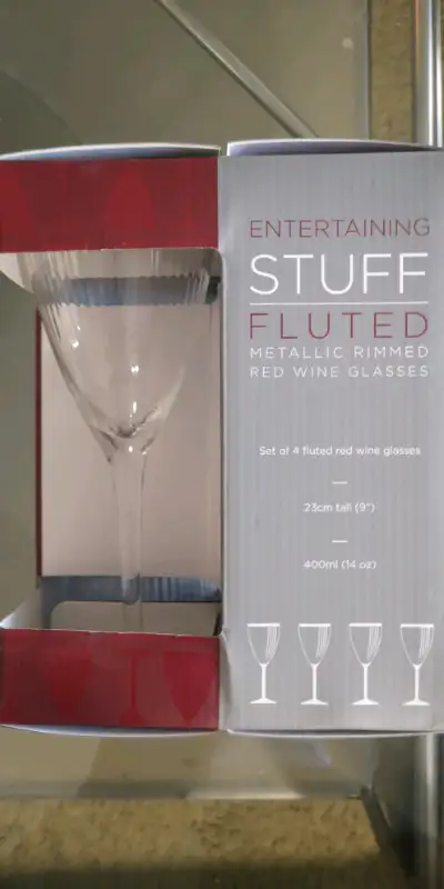 Brand new in box, fluted metallic gold rimmed red wine glasses... $40