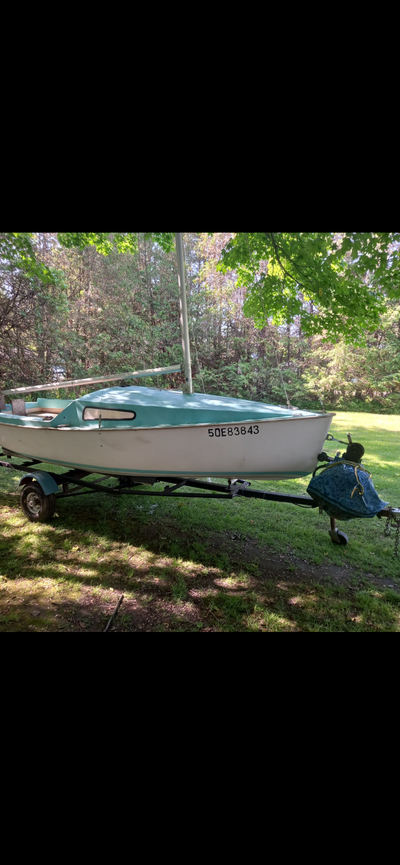 13ft Sailboat w/ Sails, Trailer & Brand-New Trolling Motor. 13’ fiberglass sailboat – Stable and beg...