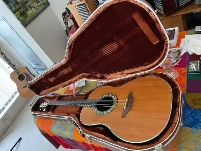 Ovation 1121-4 complete with $100 Ovation hard case. Has a few blemishes on the top sound board. See...