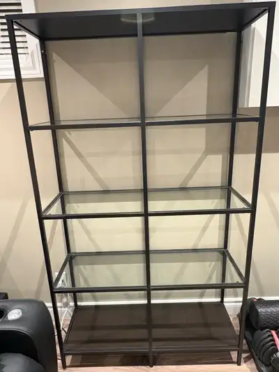 Selling this display cabinet with metal frame and glass shelves. Top and bottom have wood shelves fo...