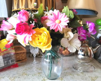 Bunch of fake flowers with glass vase