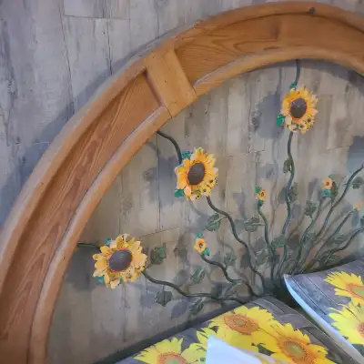 Handcrafted sunflower motive queen/king size metal/wood headboard and two side tables. Headboard dim...