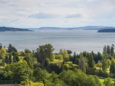 Sweeping views of Haro Strait and Mount Baker condo located in the heart of Cordova Bay. Walking dis...