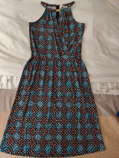 Lovely Micheal Kors Summer dress. Never worn. Stretchy, non-wrinkle material can easily be folded in...