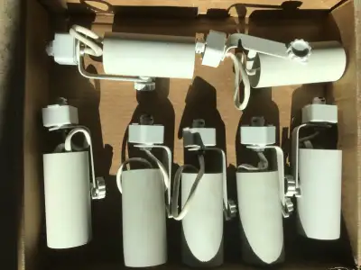 These lighting heads (the part that connects to the track and holds the bulb) were used in an art ga...