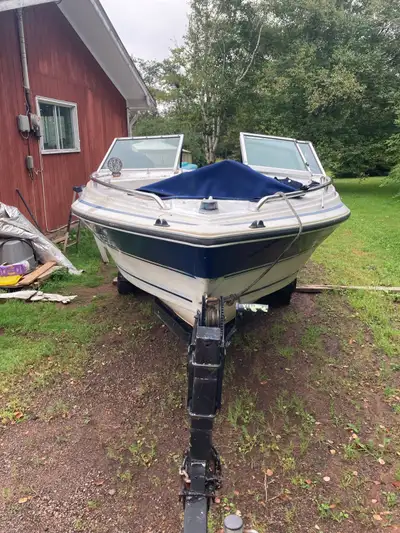New shifter cable, omc cobra outdrive, on a trailer, will need a motor. What do you have to trade?