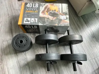 Get ready to pump some iron with this CAP 40 lb vinyl dumbbell set, designed to help you build and s...
