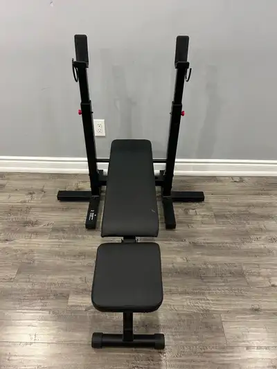Slightly used folding bench press. Price slightly negotiable Max weight capacity on barbell is 220lb...