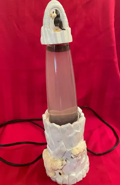 Polar themed lava lamp with polar bears and penguin. Purple colour lava.