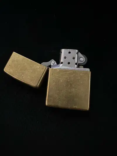 I'm offering two used Zippo lighters, perfect for collectors or everyday use. The brass Zippo has a...