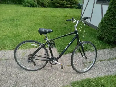 Men's bike made by Giant . 7 speed revo shift . Great for around town or Brantfords trail system. Co...