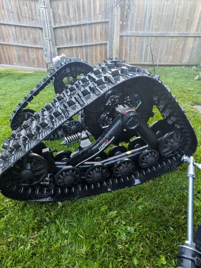 New set of 4 wheeler tracks. Less than 25 hours on them. Will fit most bikes.