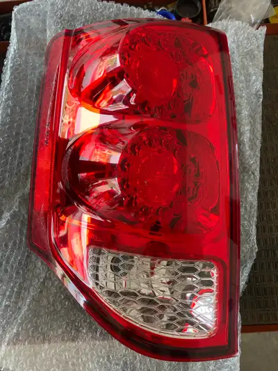 Brand New still in box, left rear taillight for 2011 - 2020 Dodge Grand Caravan.