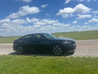 This brand new 2026 Honda Civic Touring features top-tier safety and comfort specifications, making...