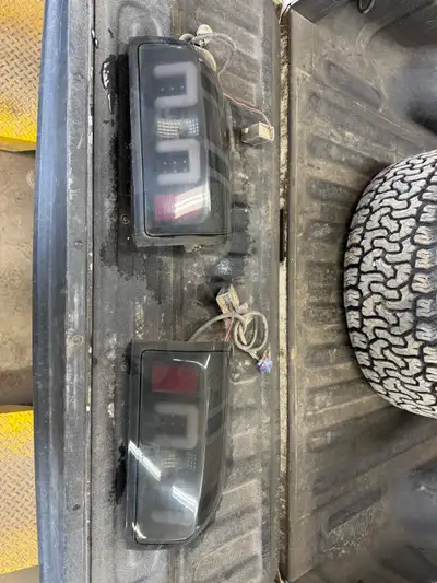 Have a set of Aftermarket taillights off a 2015 Chevy half ton. Comes with the whole wiring harness...