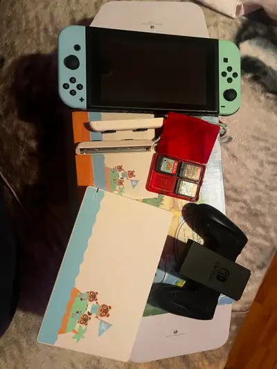 Nintendo switch ( special edition ) with 3 games and a case, View more