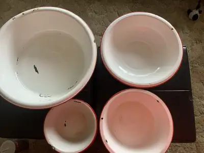 Enamelware Basins (4) with red trim measuring 16”, 12 1/2, and 10” and 7 1/2” diameter $10 each Text...