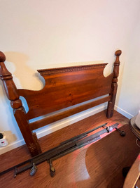 Queen sized detailed wooden headboard and frame with rollers