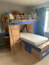 Bunk bed with a desk and a chest. Mattresses included 