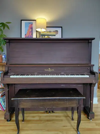 Full size upright piano with ivory keys. Unknown age. Estimated 100 years. Buyer to arrange moving....