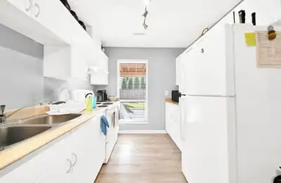 Fully renovated 2 bedroom 1 bathroom ground level basement with its own separate laundry and equippe...