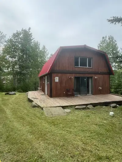 Semi-Waterfront lot with Cabin in Wizard Heights for sale. Half acre (.51) treed lot that leads to t...