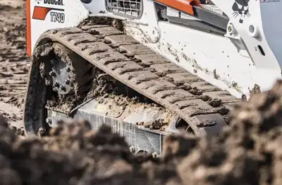 Price per track or both for $900 These Bobcat skid steer tracks are designed to provide superior tra...