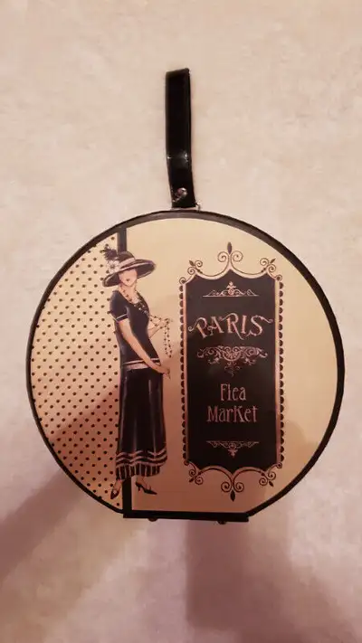 New, never used round decorative box or little tote. Small handle attached. Could hold small toys, m...