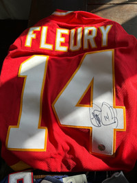 Signed Theron Fleury jersey 