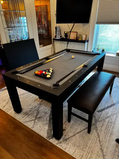 Moving out sale - selling rarely used/ like new 6 ft pool table with dining table top. All inclusive...