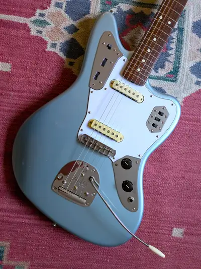 Very nice Ice Blue Metallic '62 AVRI Jaguar from 2003. This guitar is in exceptional condition with...
