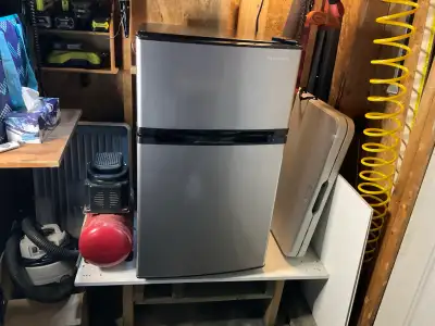 This is a brand new Insignia mini fridge from Best Buy. Perfect for a dorm room, office, small apart...