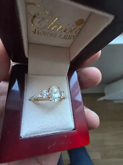 Total Diamond Weight: 2.13 Carats 1.25 Carat GIA Certified Oval Brilliant Center Diamond Color: G Cl...