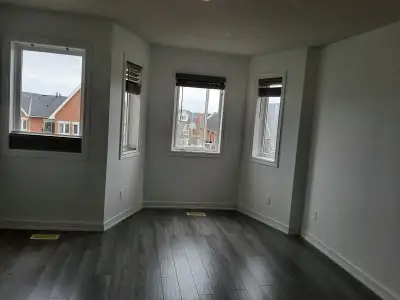 Great Location! Bright And Spacious 2+1 End-Unit Condo Townhome Located In A Highly Desirable Burlin...