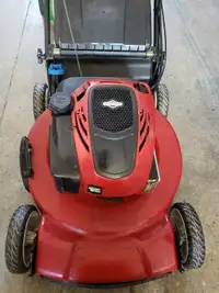 Toro self-propelled lawn mower with electric start.
