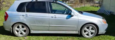 Spectra 5 runs well. New clutch and exhaust. Recent tune up. Gets good milage. Spare set of winter t...