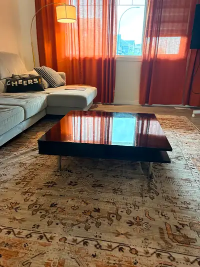 Selling a stylish black square coffee table in great condition. Its clean, with a glossy top and met...