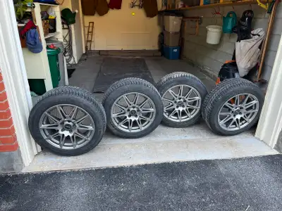 Michelin snow tires (4) on wheels. Size: 215/55R17. 27,000 Kms. $550.