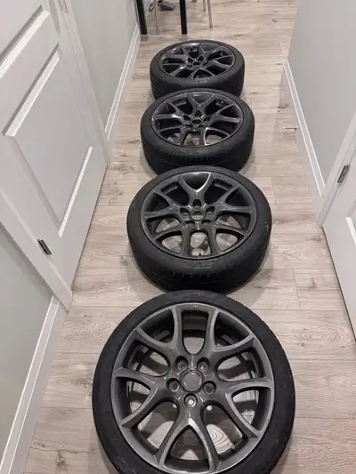 Selling a set of 4 OEM second-gen Mazdaspeed3 wheels (18x7.5”, 5x114.3 bolt pattern) wrapped in Nank...