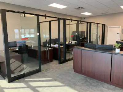 4 offices against wall, with sliding glass doors with hardware Approx. 40 feet long x 8 feet wide. E...