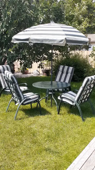 Beautiful 6-piece patio furniture set available. Tempered-glass table with four metal chairs, comfor...