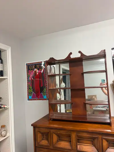 Vintage Wall Mount is made of wood and has mirror tiles along the back I used it to sit on top of a...