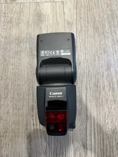 This is a Canon Speedlite 580EX II flash, known for its reliable performance and E-TTL II compatibil...