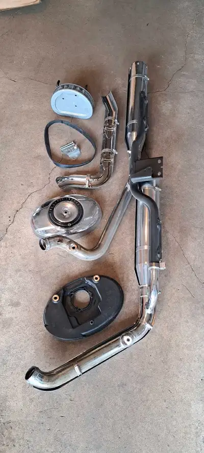 This Ad is for one factory exhaust system for a Harley Davidson Motorcycle (1999-2015). My best gues...