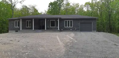 Brand new, stunning, country home for rent. This 4-bedroom bungalow sits on 5 acres of forest on a q...