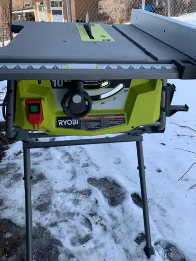 This is a used Ryobi 10-inch table saw, perfect for various woodworking projects. It's in good worki...