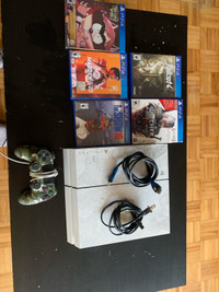 PS4 console with controller and 5 games